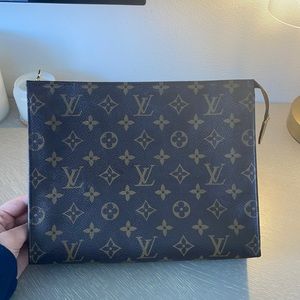 Authentic Louis Vuitton makeup bag. Barely used and in awesome condition!